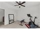 Bright home gym featuring modern exercise equipment, neutral carpet, and great lighting for a comfortable workout space at 1345 Hilltop Overlook Dr, Marietta, GA 30062
