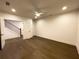 A bedroom with neutral walls, a ceiling fan, and a view of the stairs at 160 Chiswick Cir # 2, Alpharetta, GA 30009
