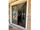Open entryway with direct view to the kitchen featuring wood floors and neutral walls at 160 Chiswick Cir # 2, Alpharetta, GA 30009