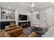 Cozy living room with hardwood floors, modern furnishings, and open staircase at 160 Chiswick Cir # 2, Alpharetta, GA 30009