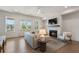 Well-decorated living room featuring a fireplace, natural light, and modern furniture at 160 Chiswick Cir # 2, Alpharetta, GA 30009