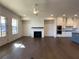 Spacious living room featuring hardwood floors, fireplace, and a ceiling fan at 160 Chiswick Cir # 2, Alpharetta, GA 30009