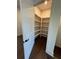 Walk-in pantry with wood floors and shelving at 160 Chiswick Cir # 2, Alpharetta, GA 30009