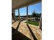 Open porch featuring stone flooring and striking white columns offering an inviting outdoor space at 160 Chiswick Cir # 2, Alpharetta, GA 30009