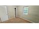 Bedroom features neutral carpet, window, and closet at 3226 Bruckner Blvd, Snellville, GA 30078