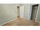This bedroom features neutral carpet and closets at 3226 Bruckner Blvd, Snellville, GA 30078