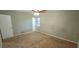 Cozy bedroom showcasing neutral walls, carpeted floors, a ceiling fan, and an ensuite bath entrance at 3226 Bruckner Blvd, Snellville, GA 30078