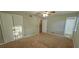Bedroom with double closets, a ceiling fan, carpeted floors, and access to the ensuite bath at 3226 Bruckner Blvd, Snellville, GA 30078