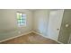 This bedroom has a neutral carpet and a closet at 3226 Bruckner Blvd, Snellville, GA 30078
