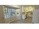 Bright kitchen with white appliances and an eat-in area surrounded by large windows at 3226 Bruckner Blvd, Snellville, GA 30078