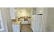 Kitchen area equipped with white cabinets and appliances, offering ample counter space at 3226 Bruckner Blvd, Snellville, GA 30078
