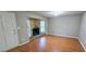 Cozy living room featuring hardwood floors and a stone fireplace at 3226 Bruckner Blvd, Snellville, GA 30078