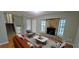 Living room featuring a stone fireplace, hardwood floors, and modern furniture at 3226 Bruckner Blvd, Snellville, GA 30078
