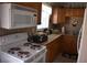 Well-lit kitchen featuring wooden cabinets and modern appliances at 3400 Scott Dr, Austell, GA 30106