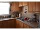 Functional kitchen featuring wood cabinets, countertops, and a stainless steel sink at 3400 Scott Dr, Austell, GA 30106