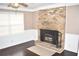Inviting living room features a classic brick fireplace and dark hardwood floors at 3400 Scott Dr, Austell, GA 30106