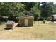 Backyard featuring a shed for additional storage space at 3400 Scott Dr, Austell, GA 30106