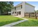 Backyard featuring green grass and a patio at 5399 Emily Cir, Ellenwood, GA 30294