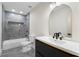 Updated bathroom with black vanity, black hardware, and a tiled shower at 5399 Emily Cir, Ellenwood, GA 30294