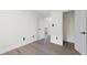 Bedroom with gray hardwood floors and closet space at 5399 Emily Cir, Ellenwood, GA 30294