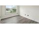 Bright bedroom features hardwood floors and a large window at 5399 Emily Cir, Ellenwood, GA 30294