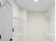 Large walk-in closet with a white door and plenty of shelving space at 5399 Emily Cir, Ellenwood, GA 30294