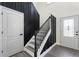 Charming entryway featuring a new door, stairs, and modern black accents creating a stylish space at 5399 Emily Cir, Ellenwood, GA 30294
