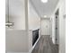 Well-lit upstairs hallway features modern lighting and neutral walls leading to various rooms at 5399 Emily Cir, Ellenwood, GA 30294