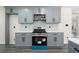 Updated kitchen with stainless steel appliances and grey cabinetry for a modern, stylish look at 5399 Emily Cir, Ellenwood, GA 30294