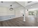 Spacious living room with modern finishes, featuring wood floors and an open floor plan at 5399 Emily Cir, Ellenwood, GA 30294