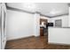 Open-concept layout shows the kitchen and dining area with hardwood floors at 876 Ivydale Ln # 63, Lawrenceville, GA 30045