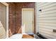 Close-up of the front door with a brick surround and welcoming doormat at 876 Ivydale Ln # 63, Lawrenceville, GA 30045