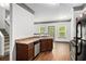 An open kitchen features stainless steel appliances, wood cabinets, and windows offering natural light at 876 Ivydale Ln # 63, Lawrenceville, GA 30045