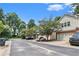 Street view showing the home's curb appeal with mature trees and landscaping at 876 Ivydale Ln # 63, Lawrenceville, GA 30045