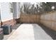 Enclosed backyard area features a concrete patio and a wood fence providing privacy and security at 1103 Coleman Sw St, Atlanta, GA 30310