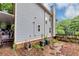 Backyard features a shed, wooden fence, mature trees, and AC units at 1103 Coleman Sw St, Atlanta, GA 30310