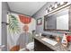Bathroom featuring a sink with granite countertop and a patterned shower curtain at 1103 Coleman Sw St, Atlanta, GA 30310