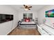 Well lit bedroom with daybed, desk and ceiling fan at 1103 Coleman Sw St, Atlanta, GA 30310