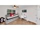 A cozy bedroom with a daybed, desk, carpet, and natural light at 1103 Coleman Sw St, Atlanta, GA 30310