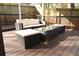 Outdoor deck with comfortable seating, including a sofa, stools, and coffee table at 1103 Coleman Sw St, Atlanta, GA 30310