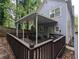 Outdoor covered deck with a seating area and a wooden railing at 1103 Coleman Sw St, Atlanta, GA 30310