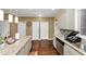 Spacious kitchen with granite countertops, gray cabinets, and stainless steel appliances at 1103 Coleman Sw St, Atlanta, GA 30310