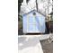 Backyard shed painted with light blue and white trim at 1103 Coleman Sw St, Atlanta, GA 30310