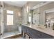 The modern bathroom features a spacious shower, double sinks, and neutral tiling at 204 Wilbur Se Ave, Atlanta, GA 30316