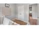 Neutral bedroom with a double-door closet, hardwood floors, and a view to the rest of the house at 204 Wilbur Se Ave, Atlanta, GA 30316