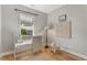 Bright Bedroom featuring a white crib, hardwood floors, and a window with neighborhood views at 204 Wilbur Se Ave, Atlanta, GA 30316