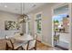 Bright dining area features modern lighting, a round table with seating, and outdoor access to the patio at 204 Wilbur Se Ave, Atlanta, GA 30316