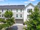 Beautiful townhouse with solar panels and an inviting front door and balcony at 204 Wilbur Se Ave, Atlanta, GA 30316