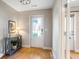 Welcoming foyer with a decorative front door, hardwood floors, and a console table with decor at 204 Wilbur Se Ave, Atlanta, GA 30316