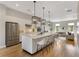 Modern kitchen with stainless steel appliances, a large island, and stylish pendant lighting at 204 Wilbur Se Ave, Atlanta, GA 30316